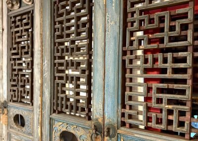 Chinese antique door panels from Chaozhou, with lattice and carvings with pastel light blue hues