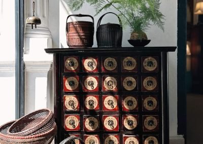 an antique chinese shanxi medicine cabinet with paper labels