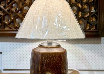 A table lamp repurposed from a unique vintage 6-sided mustard ceramic pot