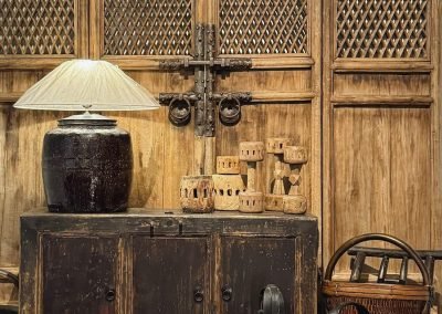 Chinese antique furniture, antique chinese door panels in natural wood colour and cast iron handles, a large old pot table lamp