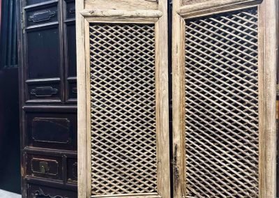 A pair of antique Shanxi window panels with lattice work