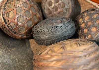 A group of vintage chinese round woven rice or lunch holders