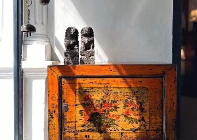 a vintage chinese gansu painted small cabinet in orange