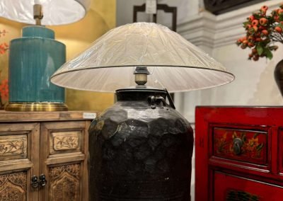 an extra large old ceramic pot converted into a table lamp